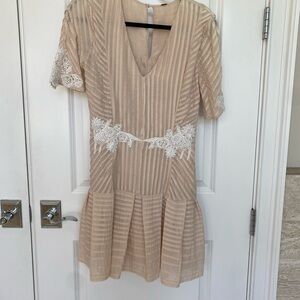 Free People. Elegant Cream Dress with Lace Accents